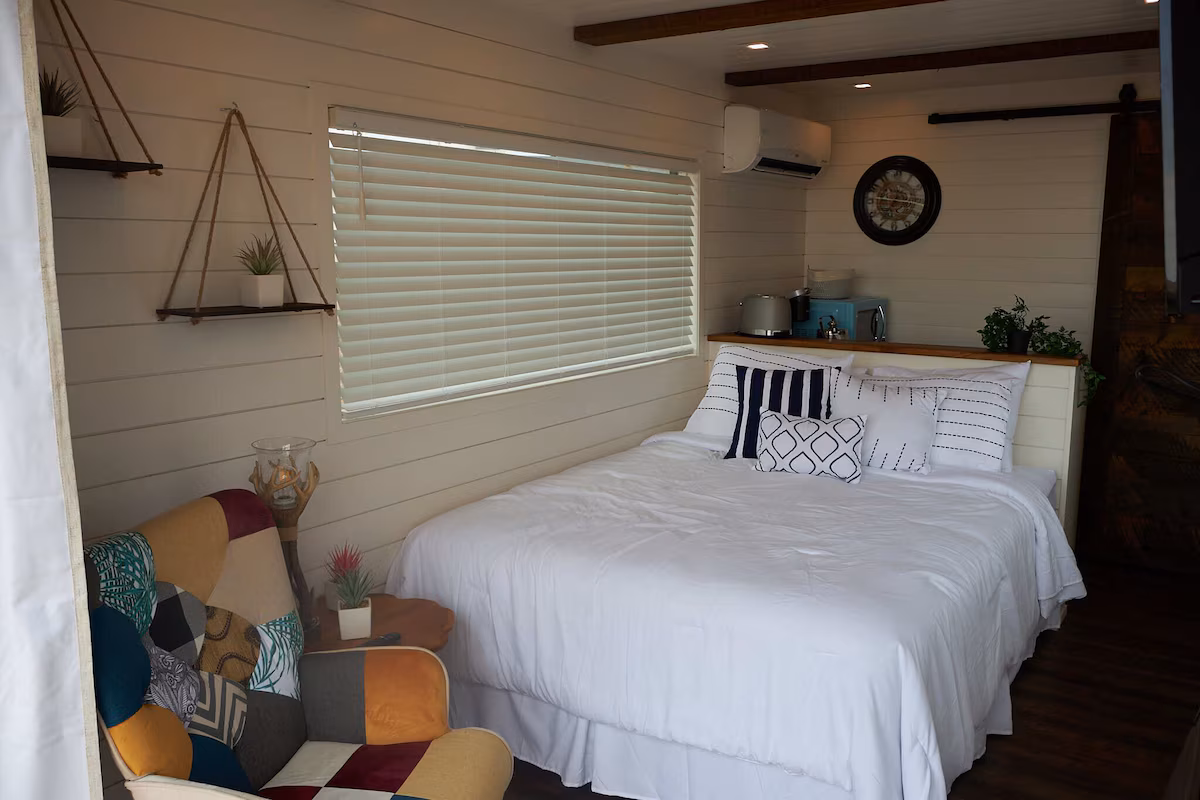 Marfa TX Hotel Deals featuring a cozy Glampinn Marfa accommodation interior with comfortable bedding and relaxing desert stay experience